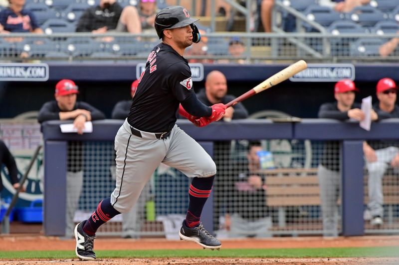 Feb 26, 2024; Peoria, Arizona, USA;  Cleveland Guardians third baseman Tyler Freeman (2) singles in the first inning against the San Diego Padres during a spring training game at Peoria Sports Complex. Mandatory Credit: Matt Kartozian-USA TODAY Sports