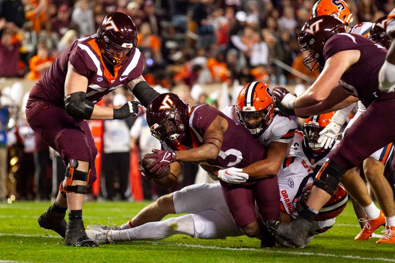 Oct 26, 2023; Blacksburg, Virginia, USA; Virginia Tech Hokies running back Bhayshul Tuten (33) runs for a touchdown during the second quarter against the Syracuse Orange at Lane Stadium. Mandatory Credit: Peter Casey-USA TODAY Sports