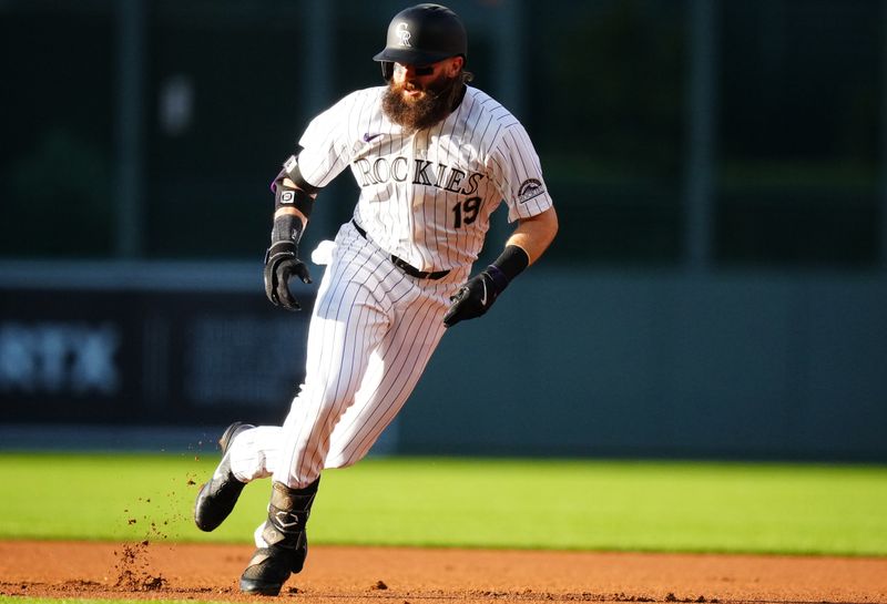 May 28, 2024; Denver, Colorado, USA; Colorado Rockies outfielder Charlie Blackmon (19) following his single in the first inning against the Cleveland Guardians at Coors Field. Mandatory Credit: Ron Chenoy-USA TODAY Sports