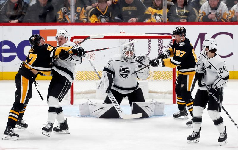 Feb 18, 2024; Pittsburgh, Pennsylvania, USA; Los Angeles Kings goaltender Cam Talbot (39) makes a glove save on a deflection attempt by Pittsburgh Penguins center Sidney Crosby (87) during the second period at PPG Paints Arena. Mandatory Credit: Charles LeClaire-USA TODAY Sports