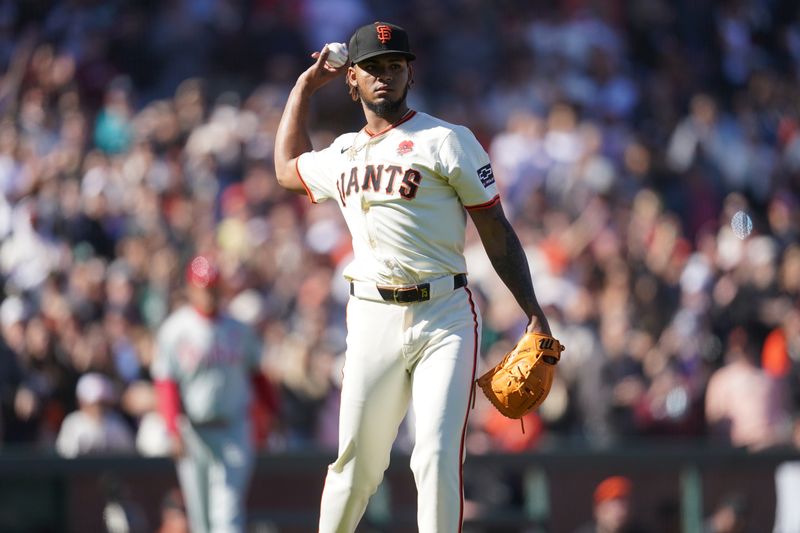 May 27, 2024; San Francisco, California, USA; San Francisco Giants pitcher Camilo Doval (75) throws the ball to first to record the final out of the game against the Philadelphia Phillies in the ninth inning at Oracle Park. Mandatory Credit: Cary Edmondson-USA TODAY Sports