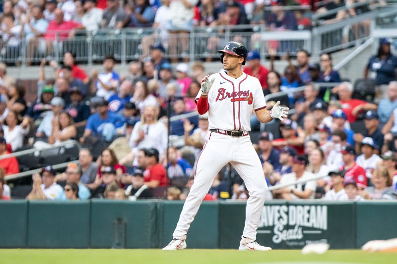 Sep 29, 2024; Cumberland, Georgia, USA; Atlanta Braves first base Matt Olson (28) celebrates a base hit against the Kansas City Royals during the eighth inning at Truist Park. Mandatory Credit: Jordan Godfree-Imagn Images