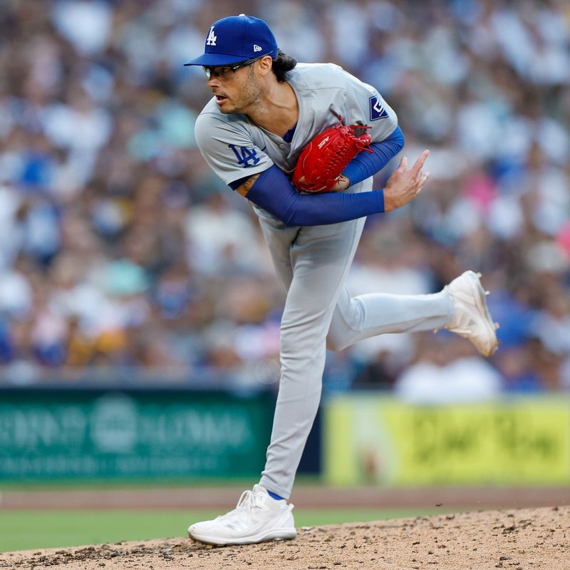 Jul 31, 2024; San Diego, California, USA; Los Angeles Dodgers relief pitcher Joe Kelly (99) pitches during the fourth inning against the Los Angeles Dodgers at Petco Park. Mandatory Credit: David Frerker-USA TODAY Sports