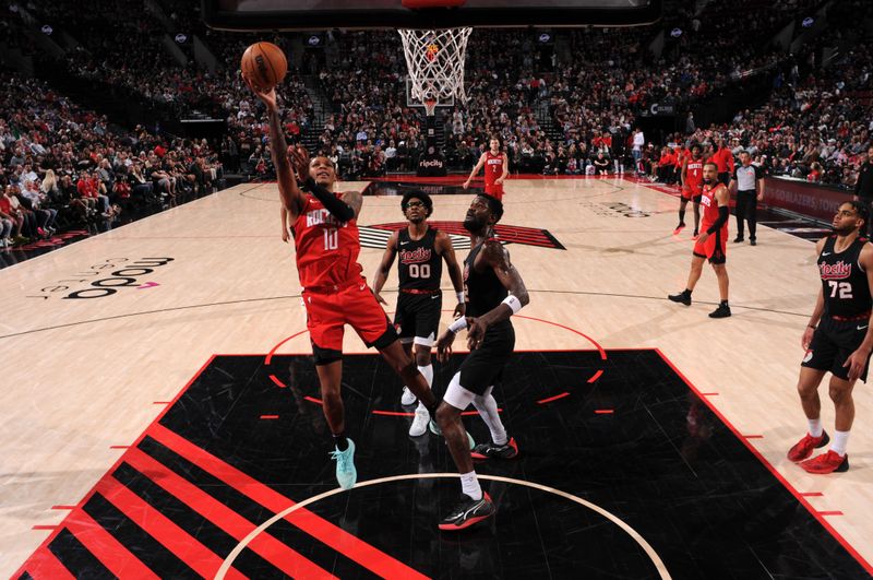 PORTLAND, OR - APRIL 12: Jabari Smith Jr. #10 of the Houston Rockets drives to the basket during the game against the Portland Trail Blazers on April 12, 2024 at the Moda Center Arena in Portland, Oregon. NOTE TO USER: User expressly acknowledges and agrees that, by downloading and or using this photograph, user is consenting to the terms and conditions of the Getty Images License Agreement. Mandatory Copyright Notice: Copyright 2024 NBAE (Photo by Cameron Browne/NBAE via Getty Images)