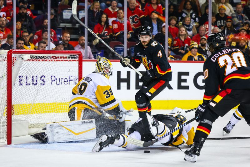 Oct 22, 2024; Calgary, Alberta, CAN; Pittsburgh Penguins goaltender Alex Nedeljkovic (39) guards his net against the Calgary Flames during the overtime period at Scotiabank Saddledome. Mandatory Credit: Sergei Belski-Imagn Images