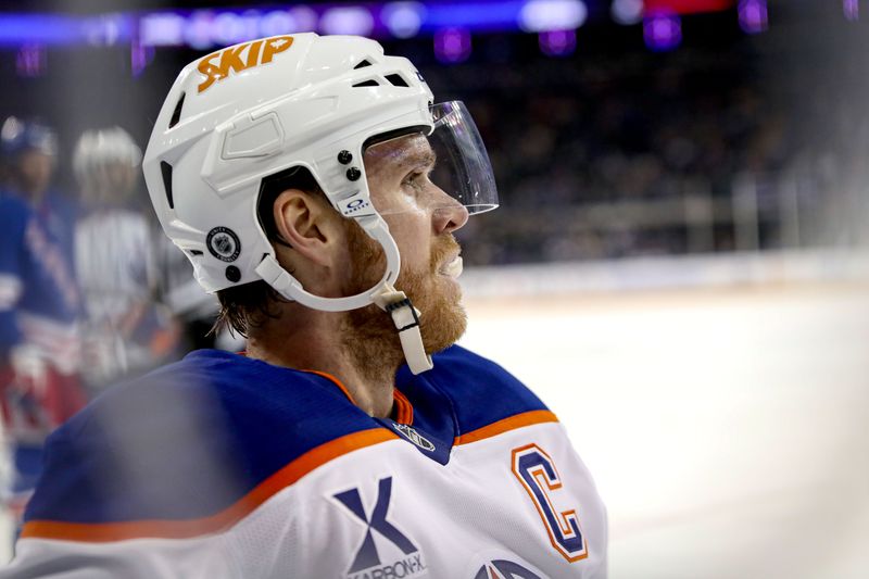 Mar 16, 2025; New York, New York, USA; Edmonton Oilers center Connor McDavid (97) kneels after a hit against the boards during the first period against the New York Rangers at Madison Square Garden. Mandatory Credit: Danny Wild-Imagn Images