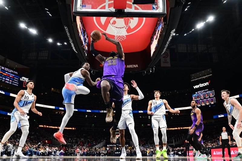 ATLANTA, GA - DECEMBER 6: LeBron James #23 of the Los Angeles Lakers drives to the basket during the game against the Atlanta Hawks on December 6, 2024 at State Farm Arena in Atlanta, Georgia.  NOTE TO USER: User expressly acknowledges and agrees that, by downloading and/or using this Photograph, user is consenting to the terms and conditions of the Getty Images License Agreement. Mandatory Copyright Notice: Copyright 2024 NBAE (Photo by Adam Hagy/NBAE via Getty Images)