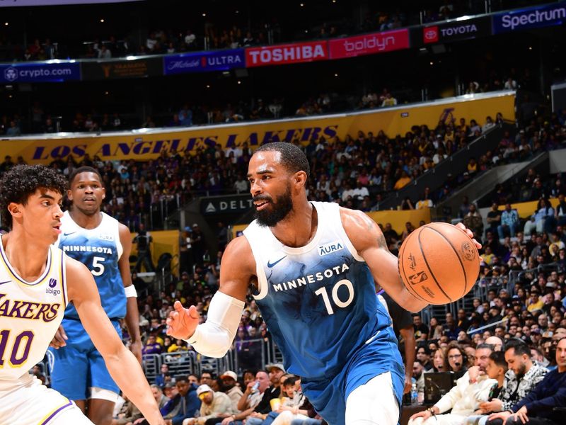 LOS ANGELES, CA - MARCH 10: Mike Conley #10 of the Minnesota Timberwolves drives to the basket during the game against the Los Angeles Lakers on March 10, 2024 at Crypto.Com Arena in Los Angeles, California. NOTE TO USER: User expressly acknowledges and agrees that, by downloading and/or using this Photograph, user is consenting to the terms and conditions of the Getty Images License Agreement. Mandatory Copyright Notice: Copyright 2024 NBAE (Photo by Adam Pantozzi/NBAE via Getty Images)