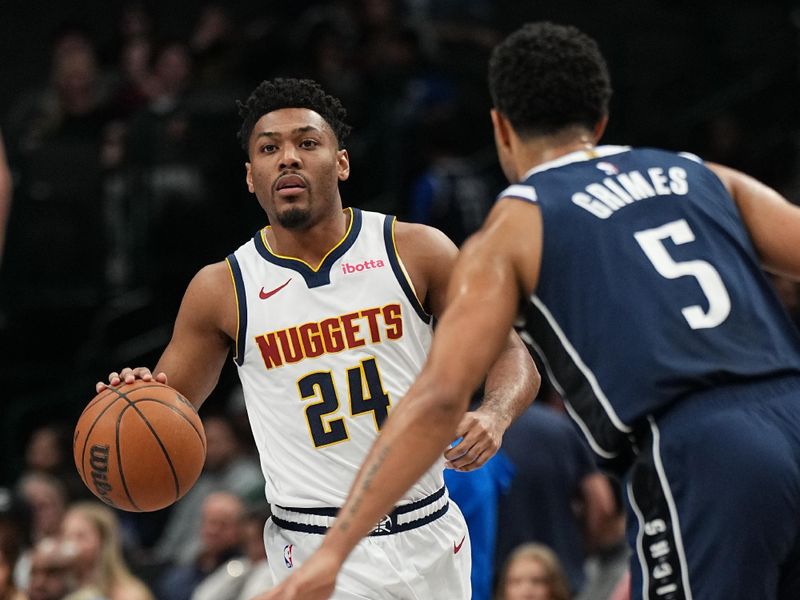 DALLAS, TX - JANUARY 14:  Jalen Pickett #24 of the Denver Nuggets dribbles the ball during the game against the Dallas Mavericks  on January 14, 2025 at American Airlines Center in Dallas, Texas. NOTE TO USER: User expressly acknowledges and agrees that, by downloading and or using this photograph, User is consenting to the terms and conditions of the Getty Images License Agreement. Mandatory Copyright Notice: Copyright 2025 NBAE (Photo by Glenn James/NBAE via Getty Images)