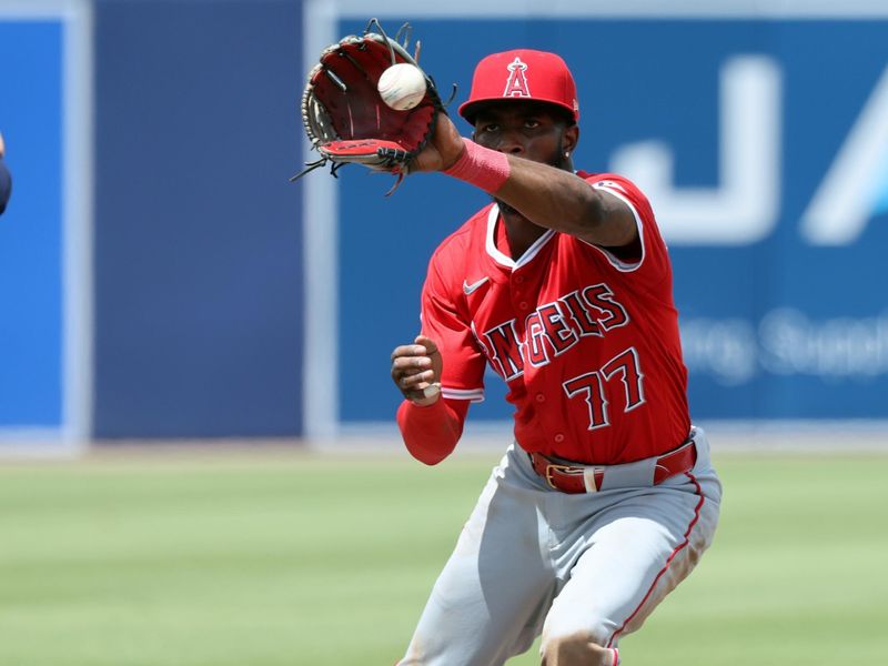 Apr 10, 2025; Tampa, Fl, USA; Los Angeles Angels shortstop Tim Anderson (77)  catches the ball for an out against the Tampa Bay Rays during the sixth inning  at George M. Steinbrenner Field. Mandatory Credit: Kim Klement Neitzel-Imagn Images
