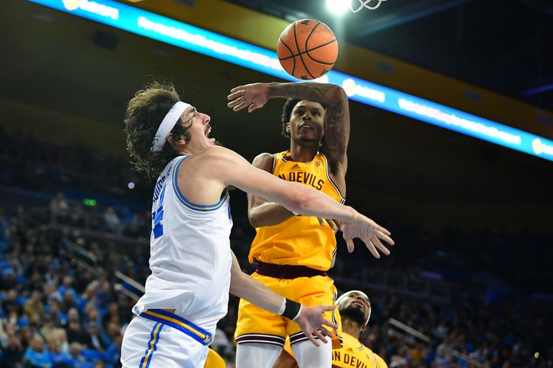 Mar 2, 2023; Los Angeles, California, USA; UCLA Bruins guard Jaime Jaquez Jr. (24) dunks for the basket against Arizona State Sun Devils guard Desmond Cambridge Jr. (4) during the second half at Pauley Pavilion. Mandatory Credit: Gary A. Vasquez-USA TODAY Sports