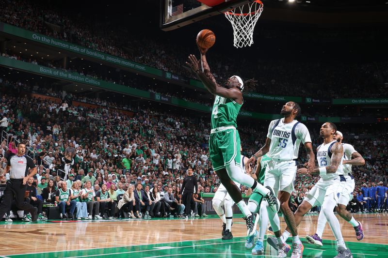 BOSTON, MA - JUNE 17: Jrue Holiday #4 of the Boston Celtics drives to the basket during the game against the Dallas Mavericks during Game 5 of the 2024 NBA Finals on June 17, 2024 at the TD Garden in Boston, Massachusetts. NOTE TO USER: User expressly acknowledges and agrees that, by downloading and or using this photograph, User is consenting to the terms and conditions of the Getty Images License Agreement. Mandatory Copyright Notice: Copyright 2024 NBAE  (Photo by Nathaniel S. Butler/NBAE via Getty Images)