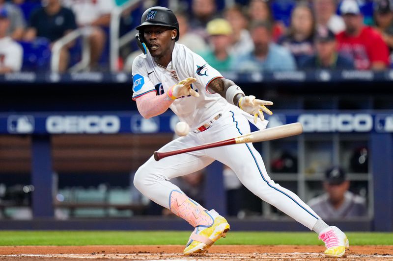 Sep 17, 2023; Miami, Florida, USA; Miami Marlins center fielder Jazz Chisholm Jr. (2) attempts a bunt against the Atlanta Braves during the first inning at loanDepot Park. Mandatory Credit: Rich Storry-USA TODAY Sports