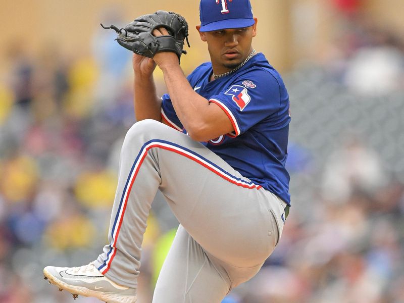 May 26, 2024; Minneapolis, Minnesota, USA;  Texas Rangers pitcher Gerson Garabito (58) delivers a pitch against the Minnesota Twins during the first inning at Target Field. Mandatory Credit: Nick Wosika-USA TODAY Sports