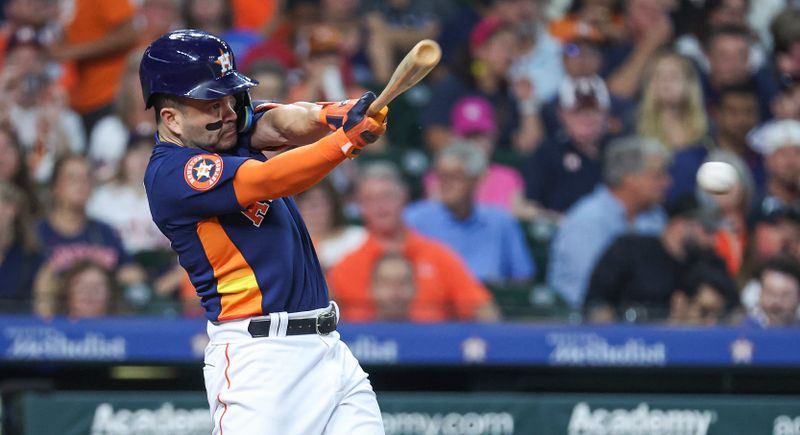 Aug 1, 2023; Houston, Texas, USA; Houston Astros second baseman Jose Altuve (27) hits a single during the third inning against the Cleveland Guardians at Minute Maid Park. Mandatory Credit: Troy Taormina-USA TODAY Sports