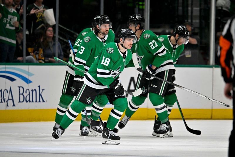 Mar 22, 2024; Dallas, Texas, USA; Dallas Stars defenseman Esa Lindell (23) and defenseman Chris Tanev (3) and center Sam Steel (18) and left wing Mason Marchment (27) and center Craig Smith (15) skate off the ice after Steel scores a goal against the Pittsburgh Penguins during the third period at the American Airlines Center. Mandatory Credit: Jerome Miron-USA TODAY Sports