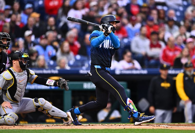 Apr 12, 2024; Philadelphia, Pennsylvania, USA; Philadelphia Phillies first baseman Bryce Harper (3) hits a single against the Pittsburgh Pirates in the first inning at Citizens Bank Park. Mandatory Credit: Kyle Ross-USA TODAY Sports