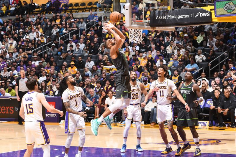 LOS ANGELES, CA - APRIL 7: Rudy Gobert #27 of the Minnesota Timberwolves goes to the basket during the game against the Los Angeles Lakers on April 7, 2024 at Crypto.Com Arena in Los Angeles, California. NOTE TO USER: User expressly acknowledges and agrees that, by downloading and/or using this Photograph, user is consenting to the terms and conditions of the Getty Images License Agreement. Mandatory Copyright Notice: Copyright 2024 NBAE (Photo by Juan Ocampo/NBAE via Getty Images)