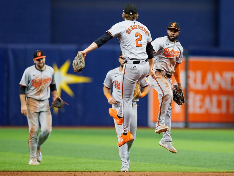 Jun 9, 2024; St. Petersburg, Florida, USA;  Baltimore Orioles shortstop Gunnar Henderson (2) and outfielder Cedric Mullins (31) celebrate after beating the Tampa Bay Rays at Tropicana Field. Mandatory Credit: Nathan Ray Seebeck-USA TODAY Sports