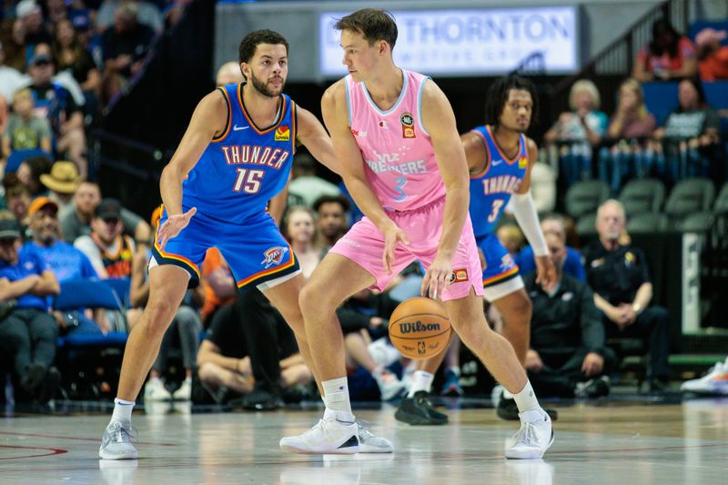 TULSA, OKLAHOMA - OCTOBER 10: Alex Reese #15 of the Oklahoma City Thunder guards Sam Mennenga #3 of the New Zealand Breakers during the second quarter at BOK Center on October 10, 2024 in Tulsa, Oklahoma.  NOTE TO USER: User expressly acknowledges and agrees that, by downloading and or using this photograph, User is consenting to the terms and conditions of the Getty Images License Agreement. (Photo by William Purnell/Getty Images)