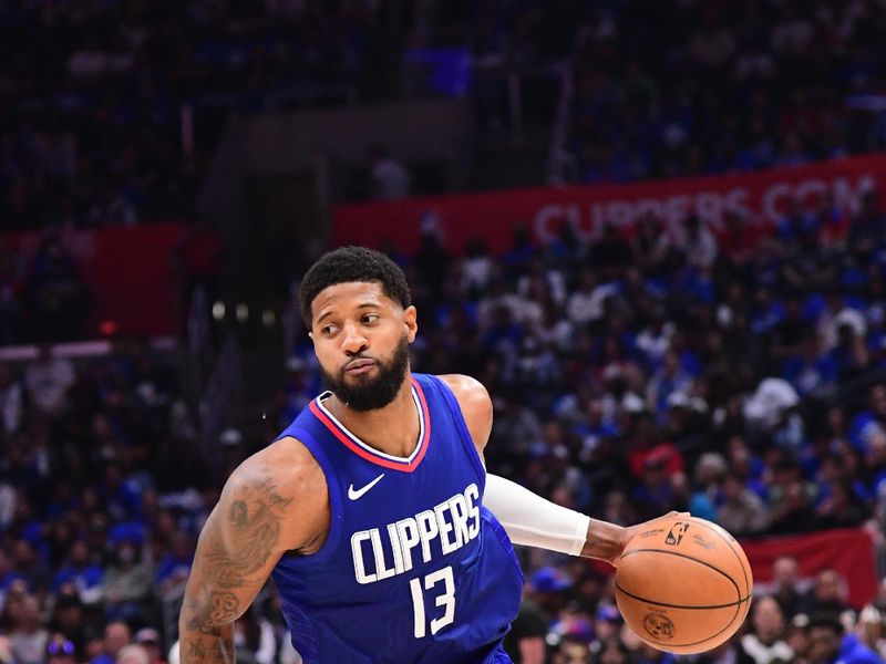 LOS ANGELES, CA - APRIL 21:  Paul George #13 of the LA Clippers handles the ball during the game against the Dallas Mavericks during Round 1 Game 1 of the 2024 NBA Playoffs on April 21, 2024 at Crypto.Com Arena in Los Angeles, California. NOTE TO USER: User expressly acknowledges and agrees that, by downloading and/or using this Photograph, user is consenting to the terms and conditions of the Getty Images License Agreement. Mandatory Copyright Notice: Copyright 2024 NBAE (Photo by Adam Pantozzi/NBAE via Getty Images)