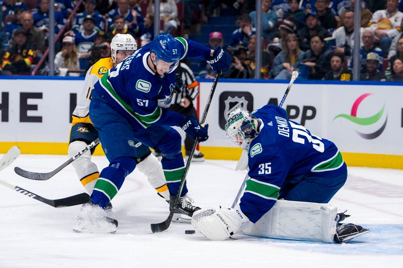 Apr 21, 2024; Vancouver, British Columbia, CAN; Vancouver Canucks defenseman Tyler Myers (57) helps goalie Thatcher Demko (35) gather a rebound against the Nashville Predators in the second period in game one of the first round of the 2024 Stanley Cup Playoffs at Rogers Arena. Mandatory Credit: Bob Frid-USA TODAY Sports