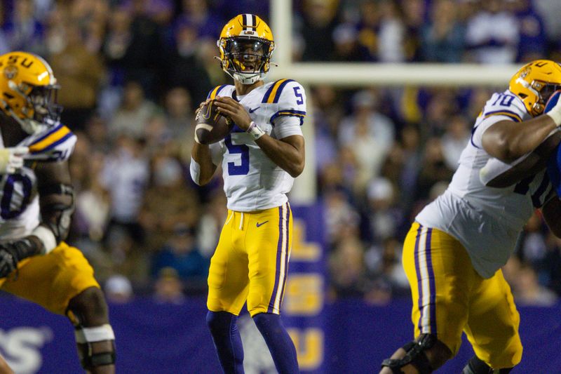 Nov 11, 2023; Baton Rouge, Louisiana, USA;  LSU Tigers quarterback Jayden Daniels (5) looks to pass against the Florida Gators during the second half at Tiger Stadium. Mandatory Credit: Stephen Lew-USA TODAY Sports