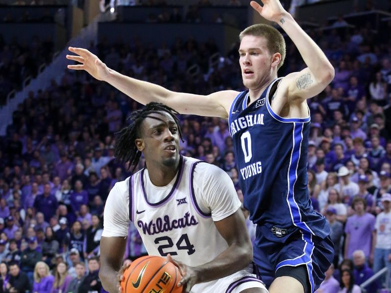 Feb 24, 2024; Manhattan, Kansas, USA; Kansas State Wildcats forward Arthur Maluma (24) is guarded by Brigham Young Cougars forward Noah Waterman (0) during the first half at Bramlage Coliseum. Mandatory Credit: Scott Sewell-USA TODAY Sports