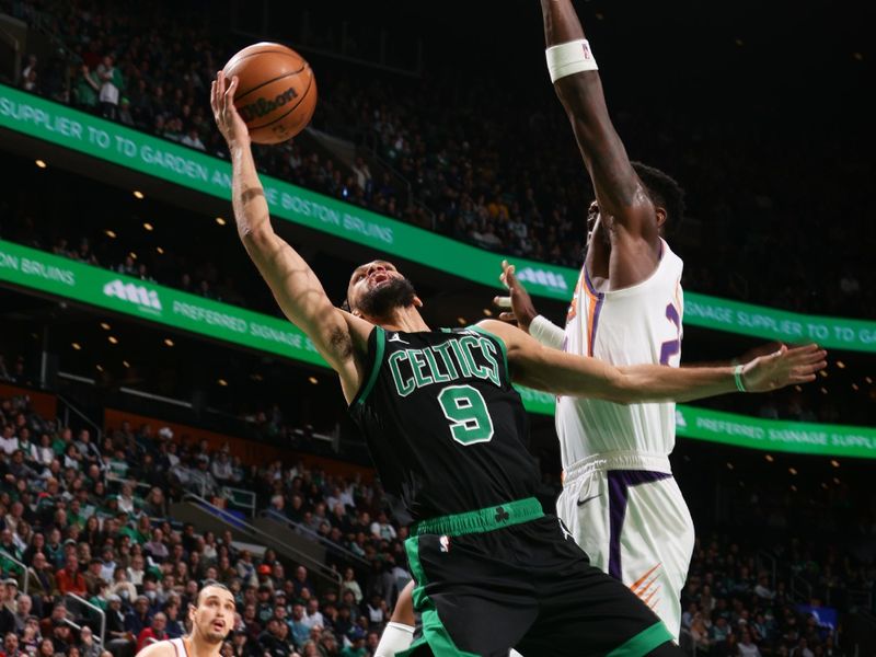 BOSTON, MA - FEBRUARY 3: Derrick White #9 of the Boston Celtics drives to the basket during the game against the Phoenix Suns on February 3, 2023 at TD Garden in Boston, Massachusetts.  NOTE TO USER: User expressly acknowledges and agrees that, by downloading and or using this photograph, User is consenting to the terms and conditions of the Getty Images License Agreement. Mandatory Copyright Notice: Copyright 2022 NBAE  (Photo by Nathaniel S. Butler/NBAE via Getty Images)