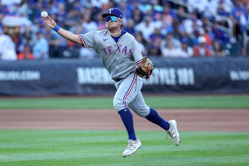 Sep 13, 2025; New York City, New York, USA;  Texas Rangers second baseman Cody Freeman (39) makes a running throw to first base in the fourth inning against the New York Mets at Citi Field. Mandatory Credit: Wendell Cruz-Imagn Images