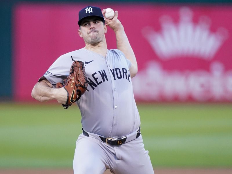 Sep 21, 2024; Oakland, California, USA; New York Yankees pitcher Carlos Rodon (55) delivers a pitch against the Oakland Athletics in the first inning at the Oakland-Alameda County Coliseum. Mandatory Credit: Cary Edmondson-Imagn Images