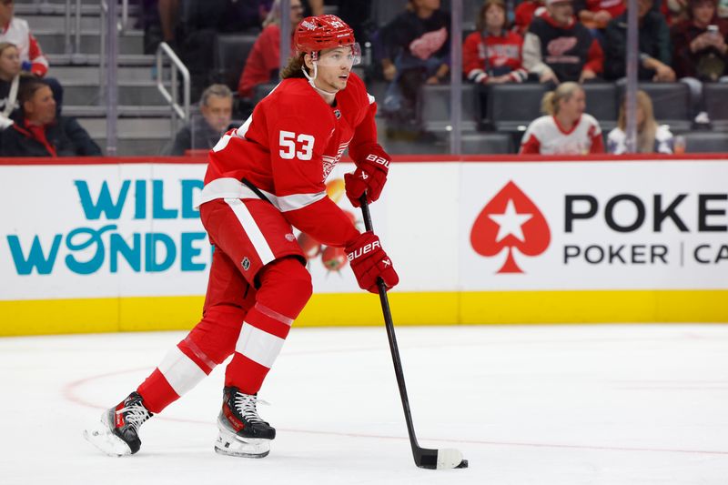 Oct 3, 2024; Detroit, Michigan, USA;  Detroit Red Wings defenseman Moritz Seider (53) skates with the puck in the first period against the Toronto Maple Leafs at Little Caesars Arena. Mandatory Credit: Rick Osentoski-Imagn Images