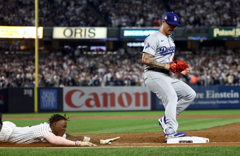 Oct 30, 2024; New York, New York, USA; Los Angeles Dodgers pitcher Anthony Banda (43) forces out New York Yankees third baseman Jazz Chisholm Jr. (13) during the second inning in game five of the 2024 MLB World Series at Yankee Stadium. Mandatory Credit: Vincent Carchietta-Imagn Images