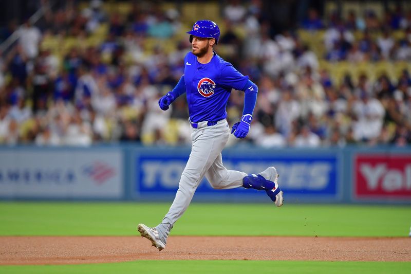 Sep 9, 2024; Los Angeles, California, USA; Chicago Cubs right fielder Cody Bellinger (24) runs the bases after hitting a solo home run against the Los Angeles Dodgers during the first inning  at Dodger Stadium. Mandatory Credit: Gary A. Vasquez-Imagn Images