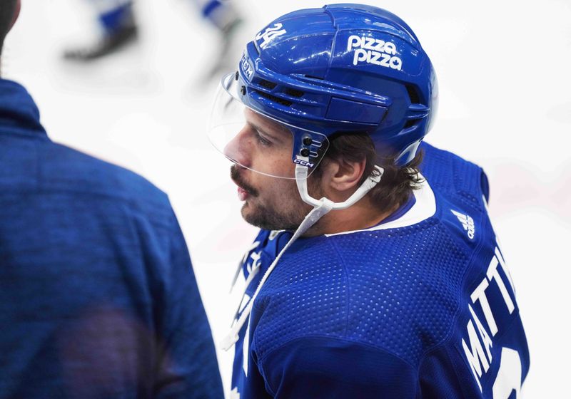 Mar 26, 2024; Toronto, Ontario, CAN; Toronto Maple Leafs center Auston Matthews (34) takes break during the warmup before a game against the New Jersey Devils at Scotiabank Arena. Mandatory Credit: Nick Turchiaro-USA TODAY Sports