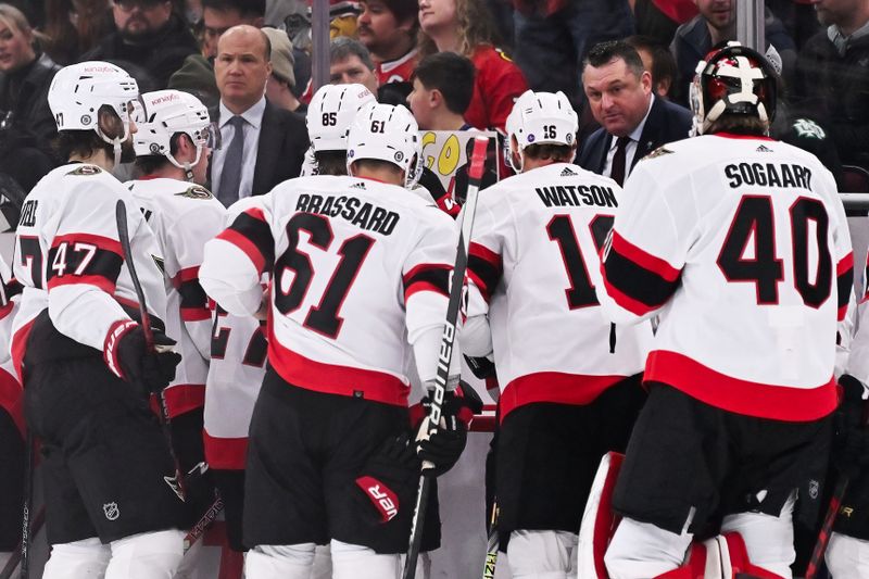 Mar 6, 2023; Chicago, Illinois, USA;  Ottawa Senators head coach D.J. Smith gathers his team for a timeout after they gave up three goals in the second period against the Chicago Blackhawks at United Center. Mandatory Credit: Jamie Sabau-USA TODAY Sports