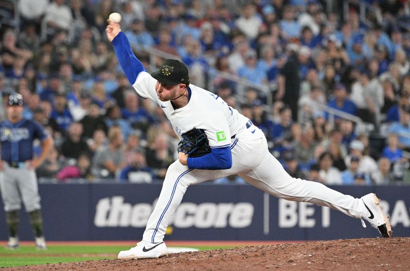 May 17, 2024; Toronto, Ontario, CAN;  Toronto Blue Jays relief pitcher Nate Pearson (24) delivers a pitch against the Tampa Bay Rays in the ninth inning at Rogers Centre. Mandatory Credit: Dan Hamilton-USA TODAY Sports