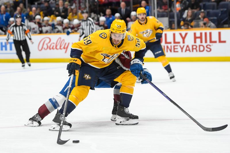 Nov 20, 2023; Nashville, Tennessee, USA;  Nashville Predators defenseman Roman Josi (59) skates with the puck against the Colorado Avalanche during the third period at Bridgestone Arena. Mandatory Credit: Steve Roberts-USA TODAY Sports