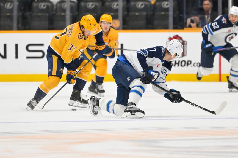 Nov 29, 2025; Nashville, Tennessee, USA;  Nashville Predators defenseman Nick Blankenburg (37) gains possession of the puck against Winnipeg Jets center Vladislav Namestnikov (7) during the first period at Bridgestone Arena. Mandatory Credit: Steve Roberts-Imagn Images