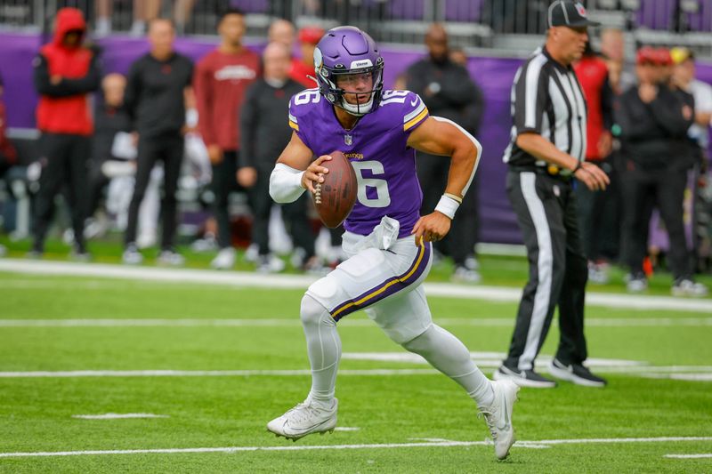 Minnesota Vikings quarterback Jaren Hall (16) scrambles against the Arizona Cardinals during the first half of an NFL preseason football game, Saturday, Aug. 26, 2023, in Minneapolis. (AP Photo/Bruce Kluckhohn)