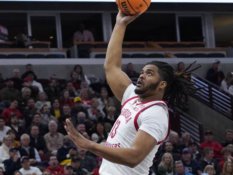 Mar 8, 2023; Chicago, IL, USA; Nebraska Cornhuskers forward Derrick Walker (13) shoots over Minnesota Golden Gophers forward Pharrel Payne (21) during the first half at United Center. Mandatory Credit: David Banks-USA TODAY Sports