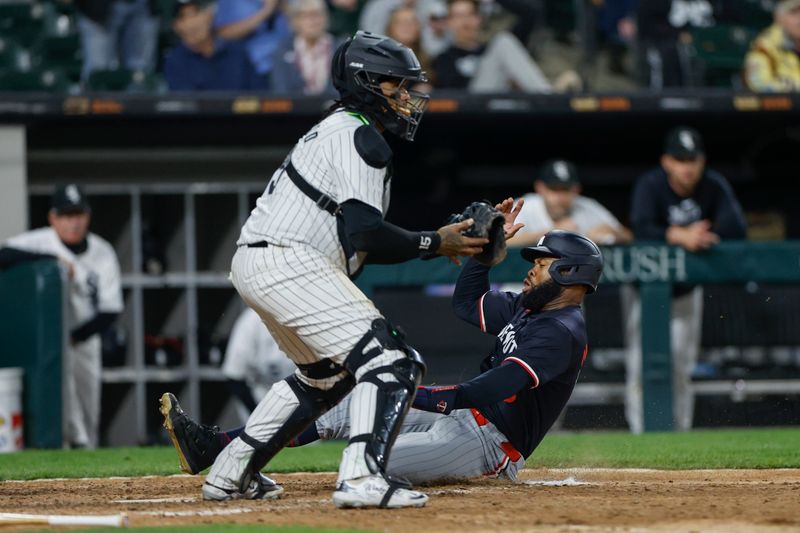 Apr 30, 2024; Chicago, Illinois, USA; Minnesota Twins outfielder Manuel Margot (13) scores against the Chicago White Sox during the eight inning at Guaranteed Rate Field. Mandatory Credit: Kamil Krzaczynski-USA TODAY Sports