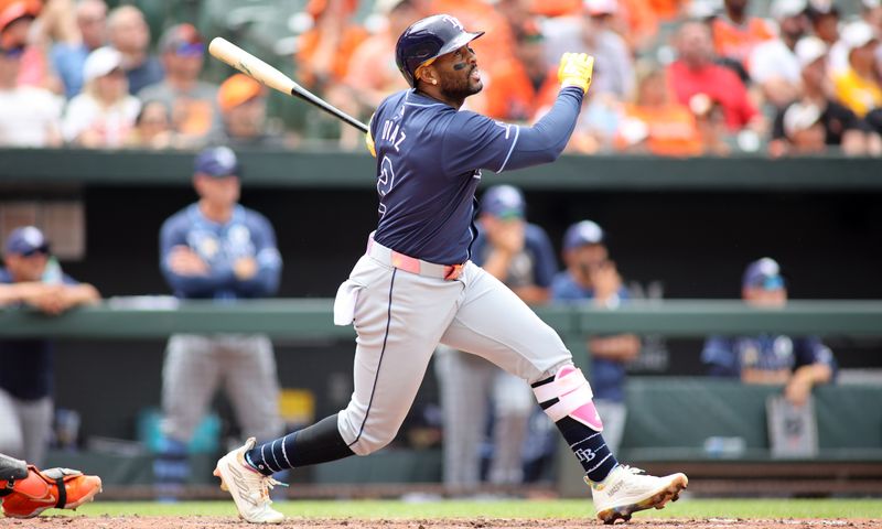 Jun 2, 2024; Baltimore, Maryland, USA; Tampa Bay Rays first base Yandy Díaz (2) swings during the fifth inning against the Baltimore Orioles at Oriole Park at Camden Yards. Mandatory Credit: Daniel Kucin Jr.-USA TODAY Sports