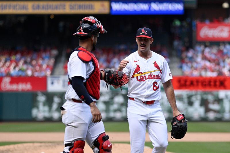 Apr 7, 2024; St. Louis, Missouri, USA; St. Louis Cardinals pitcher Ryan Fernandez (64) reacts with catcher Iván Herrera (48) during the seventh inning against the Miami Marlins at Busch Stadium. Mandatory Credit: Jeff Le-USA TODAY Sports