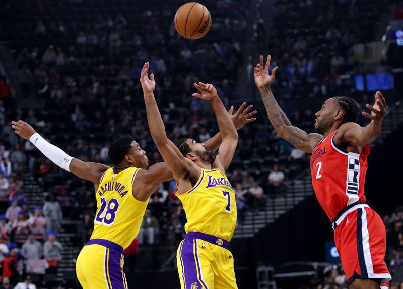 INGLEWOOD, CALIFORNIA - FEBRUARY 04: Kawhi Leonard #2 of the LA Clippers jumps for a rebound with Gabe Vincent #7 and Rui Hachimura #28 of the Los Angeles Lakers during the first half at Intuit Dome on February 04, 2025 in Inglewood, California. (Photo by Harry How/Getty Images) User expressly acknowledges and agrees that, by downloading and or using this photograph, User is consenting to the terms and conditions of the Getty Images License Agreement. (Photo by Harry How/Getty Images)