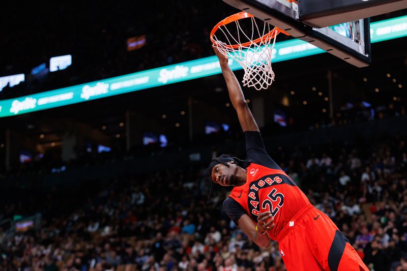 TORONTO, CANADA - OCTOBER 25: Chris Boucher #25 of the Toronto Raptors hangs on the net after dunking against the Philadelphia 76ers during the second half of their NBA game at Scotiabank Arena on October 25, 2024 in Toronto, Ontario, Canada. NOTE TO USER: User expressly acknowledges and agrees that, by downloading and or using this photograph, User is consenting to the terms and conditions of the Getty Images License Agreement. (Photo by Cole Burston/Getty Images)