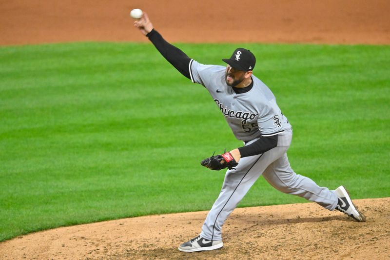 Apr 10, 2024; Cleveland, Ohio, USA; Chicago White Sox pitcher Dominic Leone (55) delivers a pitch in the seventh inning against the Cleveland Guardians at Progressive Field. Mandatory Credit: David Richard-USA TODAY Sports