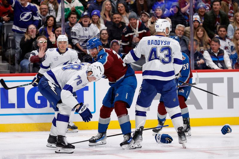 Oct 30, 2024; Denver, Colorado, USA; Tampa Bay Lightning defenseman Emil Lilleberg (78) and Colorado Avalanche center Matt Stienburg (36) scuffle ahead of defenseman Darren Raddysh (43) and defenseman Oliver Kylington (58) in the second period at Ball Arena. Mandatory Credit: Isaiah J. Downing-Imagn Images