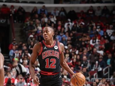 CHICAGO, IL - NOVEMBER 18: Ayo Dosunmu #12 of the Chicago Bulls dribbles the ball during the game against the Miami Heat on November 18, 2023 at United Center in Chicago, Illinois. NOTE TO USER: User expressly acknowledges and agrees that, by downloading and or using this photograph, User is consenting to the terms and conditions of the Getty Images License Agreement. Mandatory Copyright Notice: Copyright 2023 NBAE (Photo by Jeff Haynes/NBAE via Getty Images)