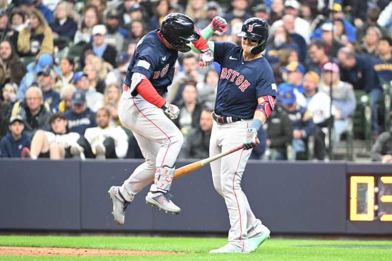 Apr 23, 2023; Milwaukee, Wisconsin, USA; Boston Red Sox left fielder Masataka Yoshida (7) celebrates with Boston Red Sox shortstop Enrique Hernandez (5) after hitting a home run against the Milwaukee Brewers at American Family Field. Mandatory Credit: Michael McLoone-USA TODAY Sports